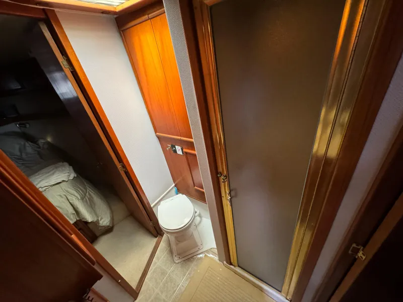 Slide: The Image of 1990 Post 44 Sport Fisherman interior with bathroom and bedroom view. - 24