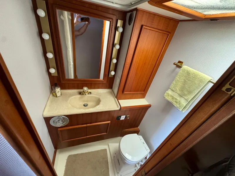 Slide: The Image of Luxurious bathroom in 1990 Post 44 Sport Fisherman yacht with wood accents and vanity. - 25