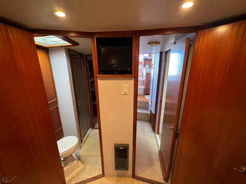 Slide: The Image of Interior of 1990 Post 44 Sport Fisherman yacht with wood paneling and bathroom. - 30