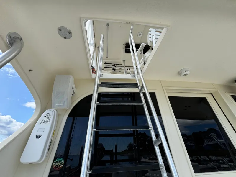 Slide: The Image of Ladder leading to upper deck on 1990 Post 44 Sport Fisherman boat. - 31