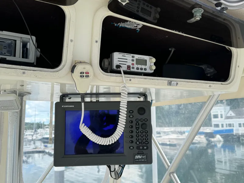 Slide: The Image of 1990 Post 44 Sport Fisherman boat electronics with navigation and communication equipment. - 35