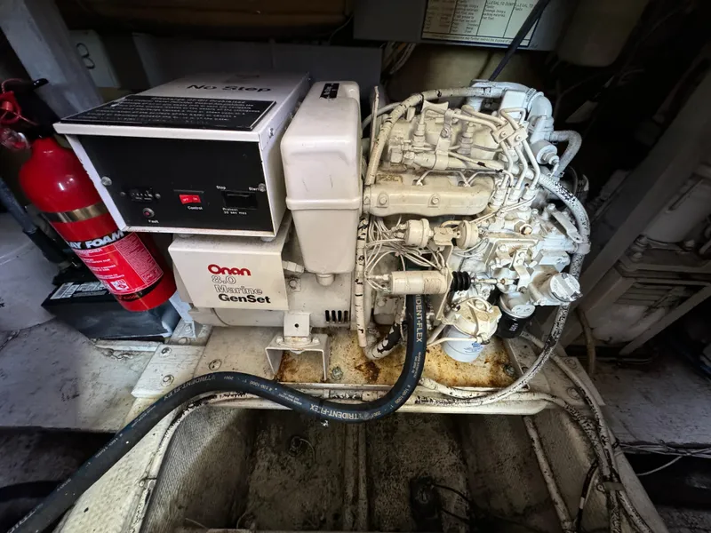 Slide: The Image of Onan Marine Genset in 1990 Post 44 Sport Fisherman engine room. - 43