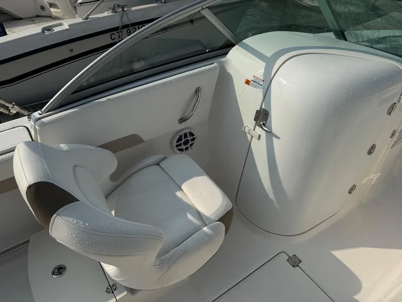 Slide: The Image of 2022 Robalo R207 Dual Console boat interior with white seating and console. - 10
