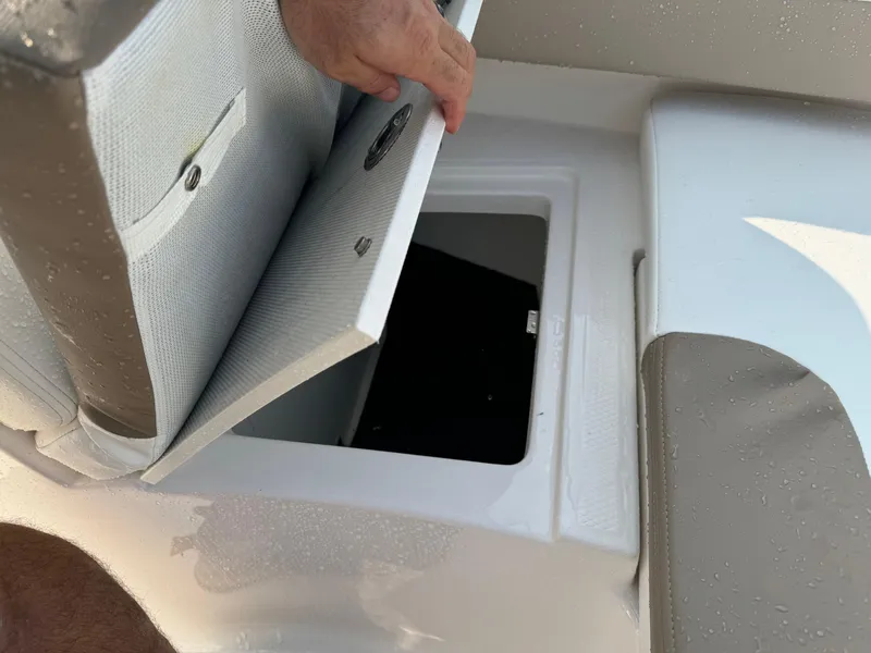 Slide: The Image of Storage compartment in 2022 Robalo R207 Dual Console boat. - 13