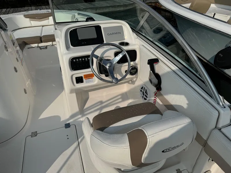 Slide: The Image of 2022 Robalo R207 Dual Console boat interior with Garmin navigation system. - 9