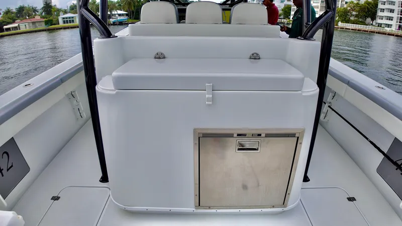 Slide: The Image of 2022 Yellowfin 42 Offshore boat interior with seating and storage. - 10