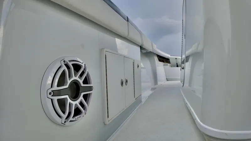Slide: The Image of 2022 Yellowfin 42 Offshore boat deck with speaker and storage compartment. - 15