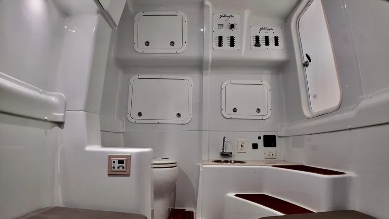 Slide: The Image of Interior of 2022 Yellowfin 42 Offshore boat, featuring modern amenities and sleek design. - 21