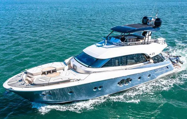 Slide: The Image of Luxurious 2018 Monte Carlo Yachts MCY 70 cruising on open water. - 10