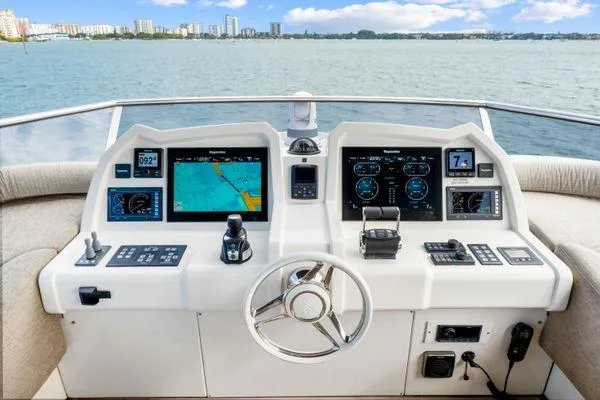 Slide: The Image of Cockpit of 2018 Monte Carlo Yachts MCY 70 with navigation displays and steering wheel. - 30