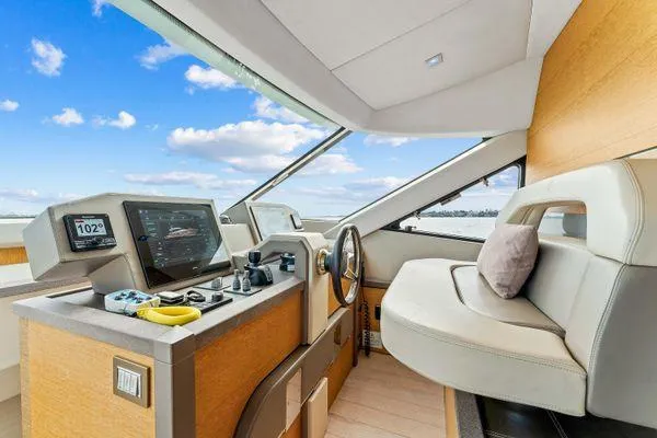 Slide: The Image of Luxurious 2018 Monte Carlo Yachts MCY 70 helm with modern controls and panoramic views. - 45