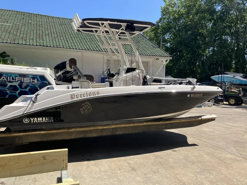 Slide: The Image of 2022 Yamaha Boats 190 FSH Sport on trailer, parked outdoors. - 1