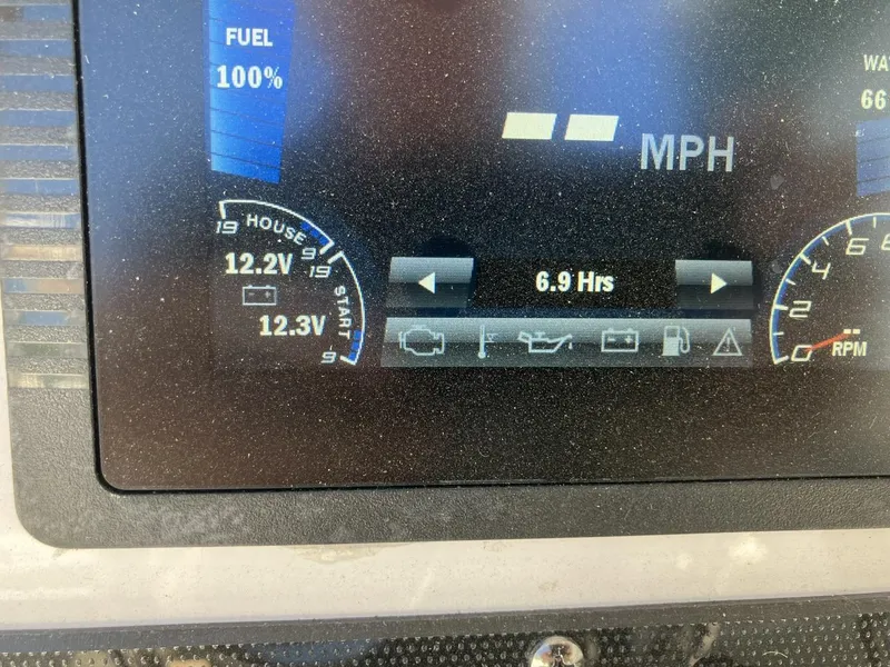 Slide: The Image of Yamaha Boats 2022 190 FSH Sport dashboard display showing fuel, voltage, and engine hours. - 15