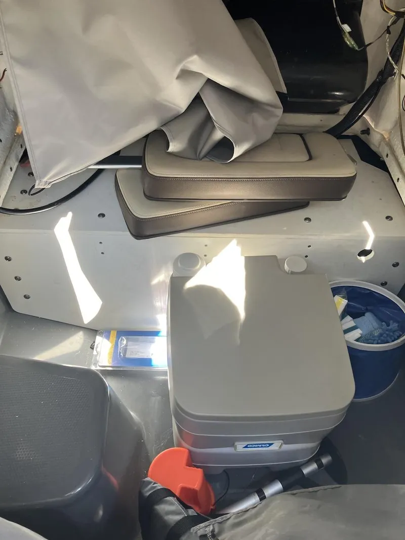 Slide: The Image of Interior of 2022 Yamaha Boats 190 FSH Sport with storage and equipment. - 16