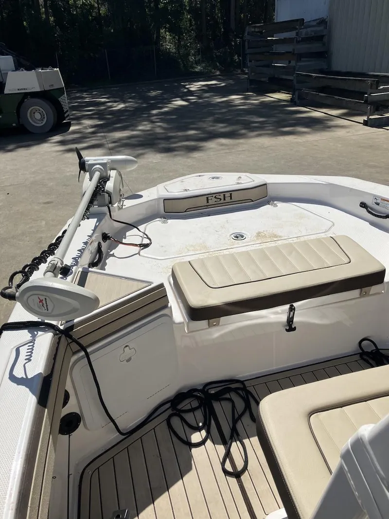 Slide: The Image of 2022 Yamaha Boats 190 FSH Sport interior with seating and equipment. - 19