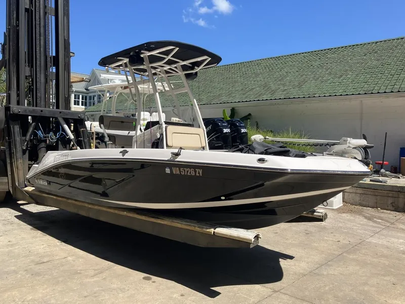 Slide: The Image of 2022 Yamaha Boats 190 FSH Sport on forklift, outdoor setting, clear sky. - 2