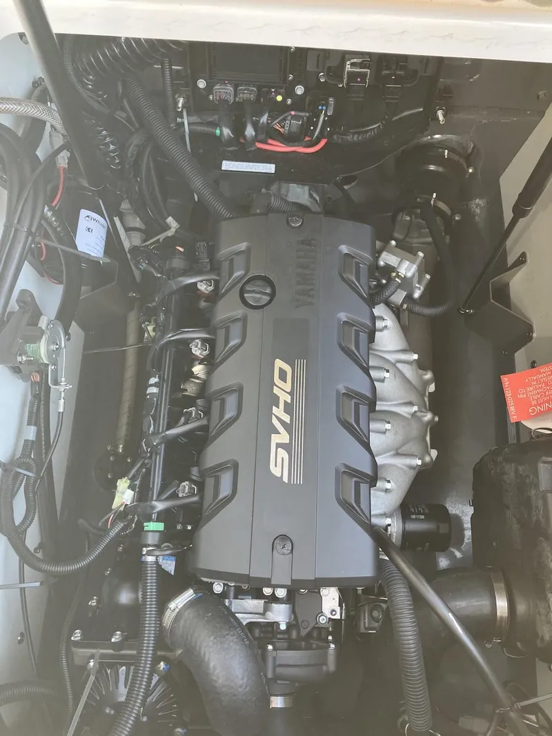 Slide: The Image of 2022 Yamaha Boats 190 FSH Sport engine compartment with SVHO engine. - 22