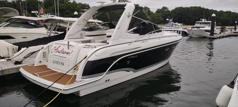 Slide: The Image of 2007 Formula 31 Cruiser docked at marina, sleek design, white and black exterior. - 0