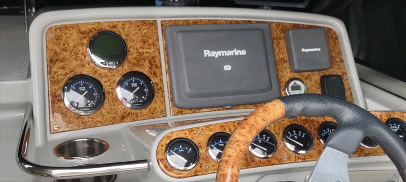 Slide: The Image of Dashboard of a 2007 Formula 31 Cruiser with Raymarine navigation system and wood finish. - 17