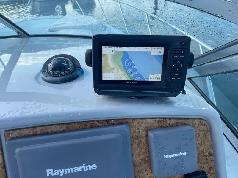 Slide: The Image of Garmin GPS and Raymarine equipment on 2007 Formula 31 Cruiser dashboard. - 18