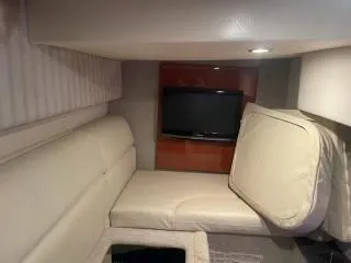 Slide: The Image of Interior of 2007 Formula 31 Cruiser with beige seating and a mounted TV. - 23