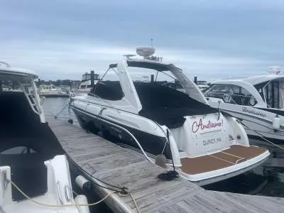 Slide: The Image of 2007 Formula 31 Cruiser docked at marina, overcast sky. - 4