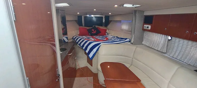 Slide: The Image of 2007 Formula 31 Cruiser interior with cozy bed and seating area. - 6