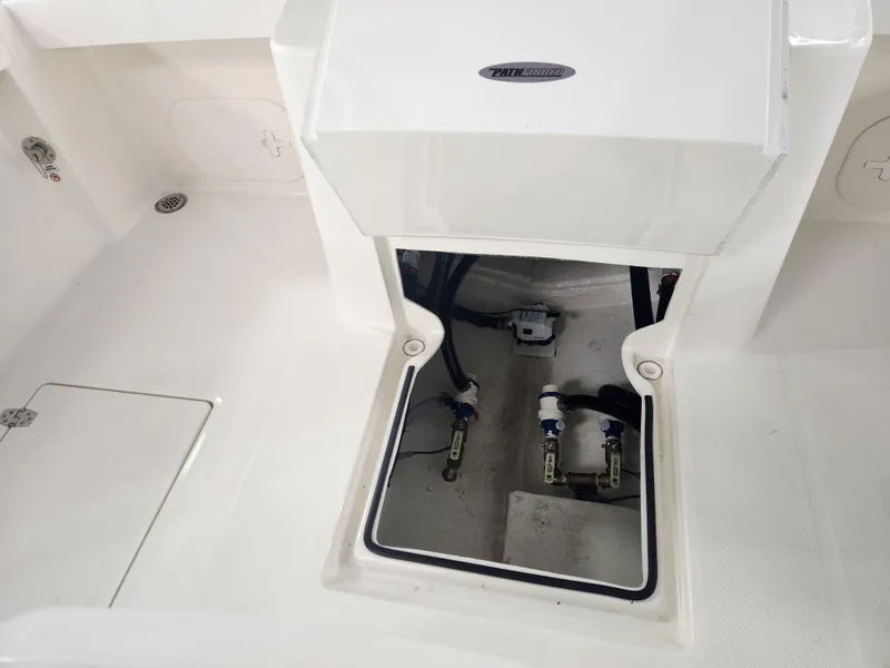 Slide: The Image of 2025 Pathfinder 2400 Open boat interior compartment with visible wiring and components. - 15