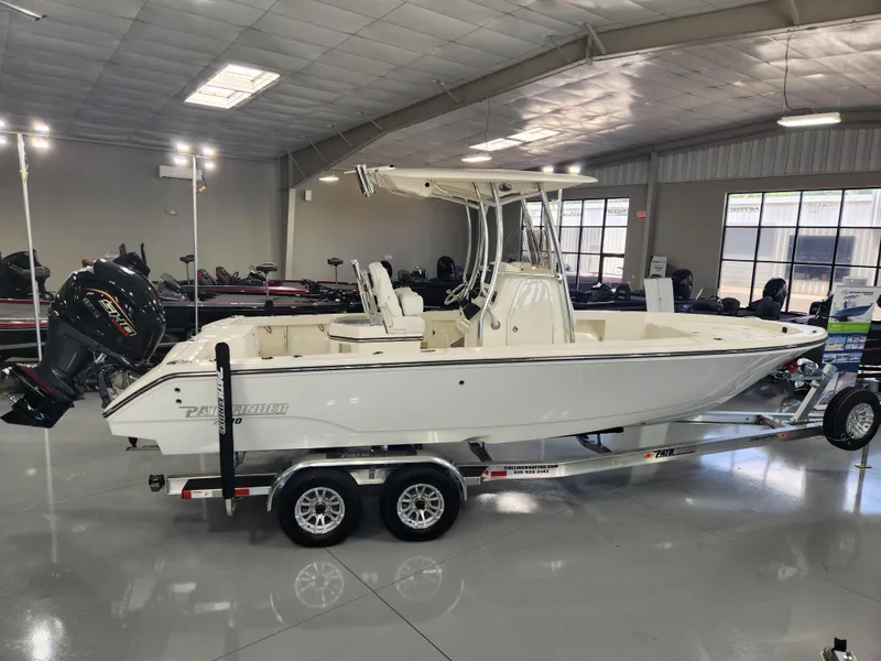 Slide: The Image of 2025 Pathfinder 2400 Open boat on trailer in showroom. - 2