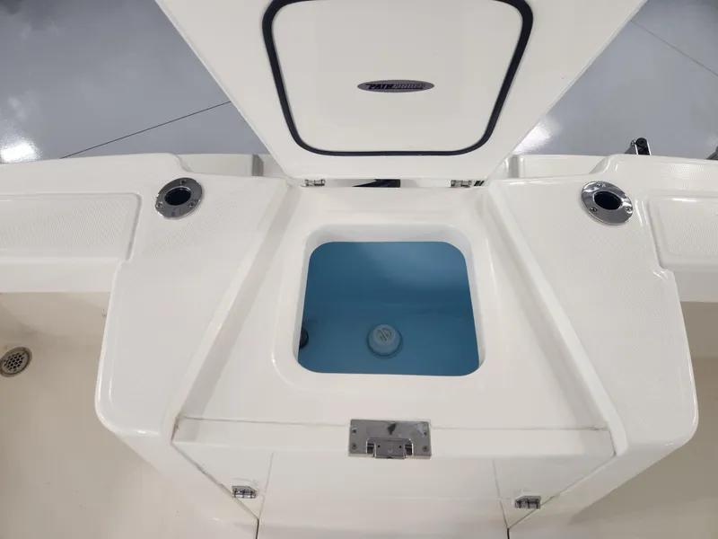 Slide: The Image of 2025 Pathfinder 2400 Open boat livewell with open lid, showcasing interior design. - 27