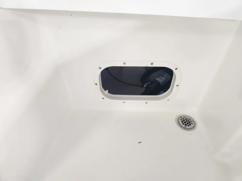 Slide: The Image of Interior view of 2025 Pathfinder 2400 Open boat, featuring a drain and access hatch. - 29