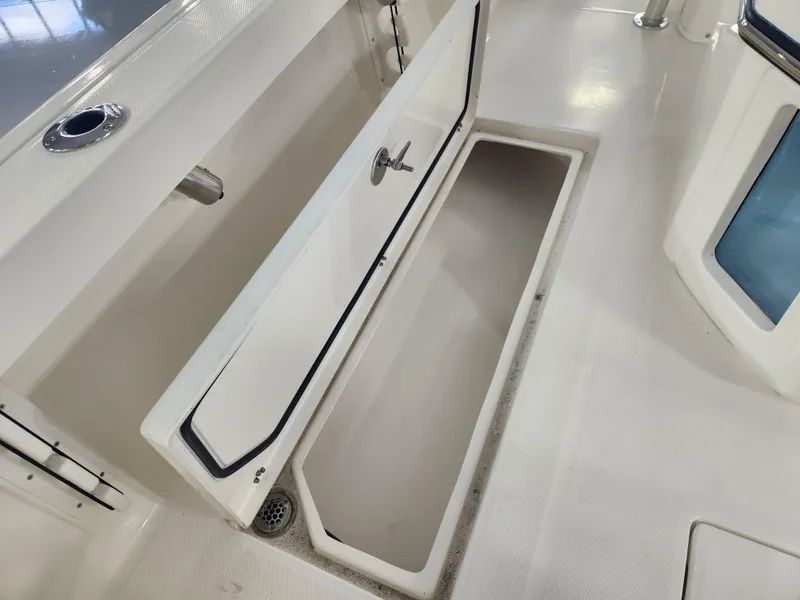 Slide: The Image of Open storage compartment on 2025 Pathfinder 2400 Open boat deck. - 31