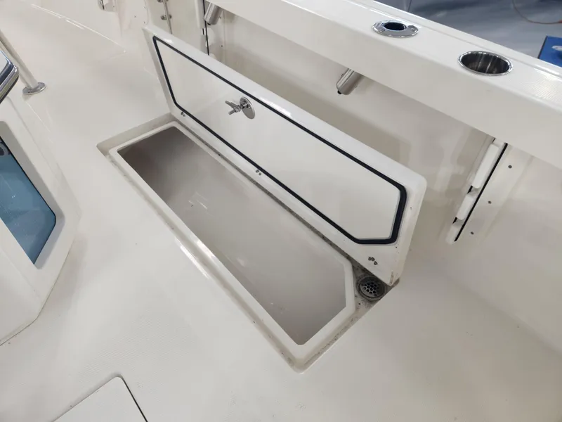 Slide: The Image of 2025 Pathfinder 2400 Open boat storage compartment with open hatch. - 32