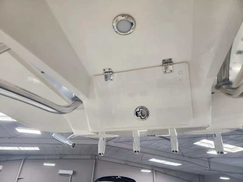 Slide: The Image of 2025 Pathfinder 2400 Open boat interior, featuring rod holders and ceiling details. - 33