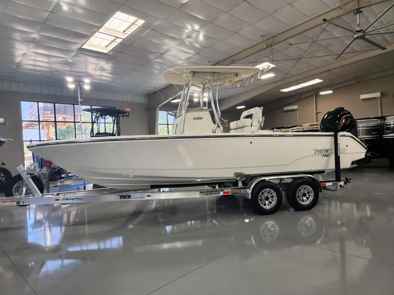 Slide: The Image of 2025 Pathfinder 2400 Open boat on trailer in showroom. - 4