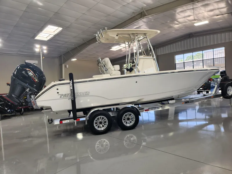 Slide: The Image of 2025 Pathfinder 2400 Open boat on trailer in showroom. - 5