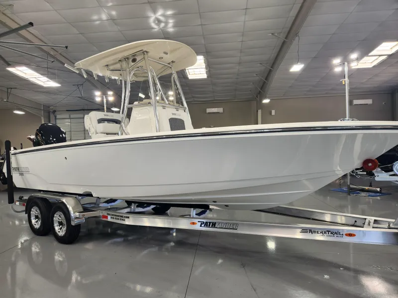 Slide: The Image of 2025 Pathfinder 2400 Open boat on trailer in showroom. - 6