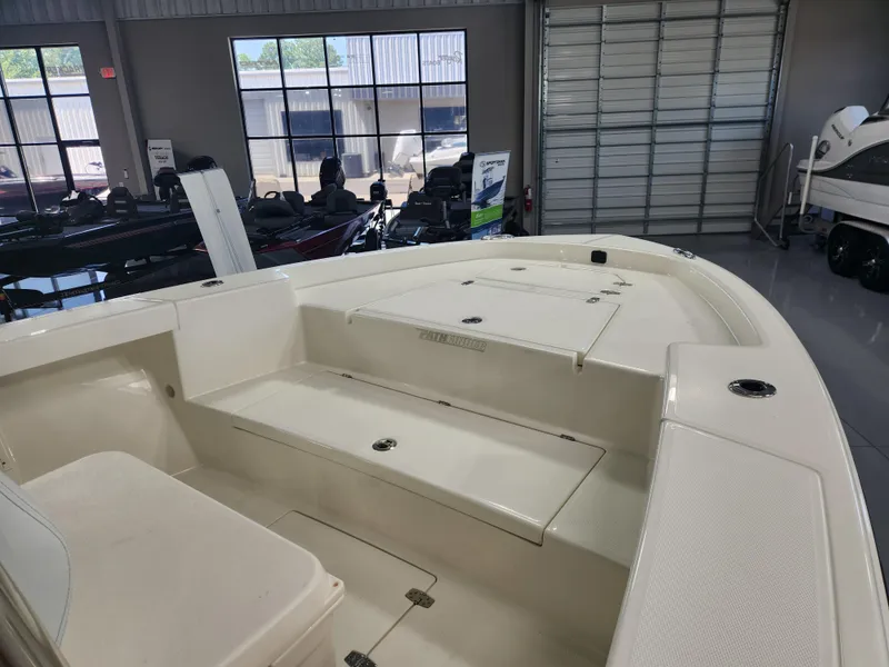 Slide: The Image of 2025 Pathfinder 2400 Open boat interior in showroom setting. - 9
