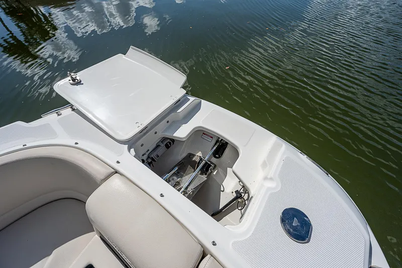 Slide: The Image of 2018 Boston Whaler 270 Vantage boat interior with open storage compartment. - 18