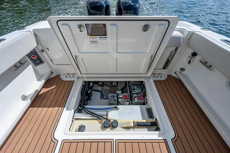 Slide: The Image of 2018 Boston Whaler 270 Vantage boat engine compartment with open hatch. - 24