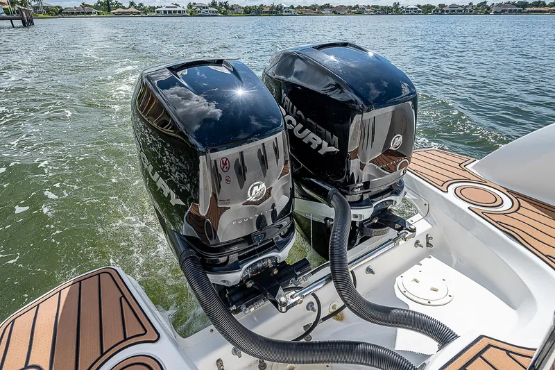 Slide: The Image of 2018 Boston Whaler 270 Vantage with twin Mercury outboard engines on water. - 29