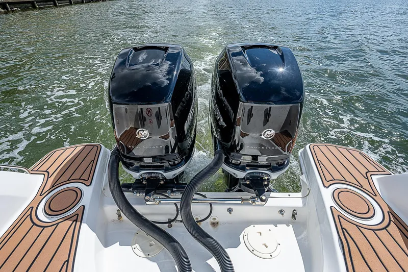 Slide: The Image of 2018 Boston Whaler 270 Vantage with dual outboard engines on water. - 30