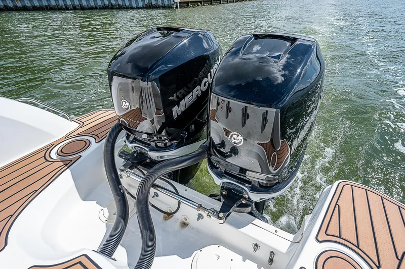 Slide: The Image of 2018 Boston Whaler 270 Vantage with dual Mercury outboard engines on water. - 31
