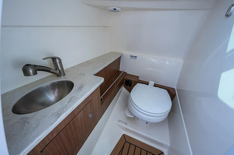 Slide: The Image of 2018 Boston Whaler 270 Vantage boat bathroom with sink and toilet. - 33