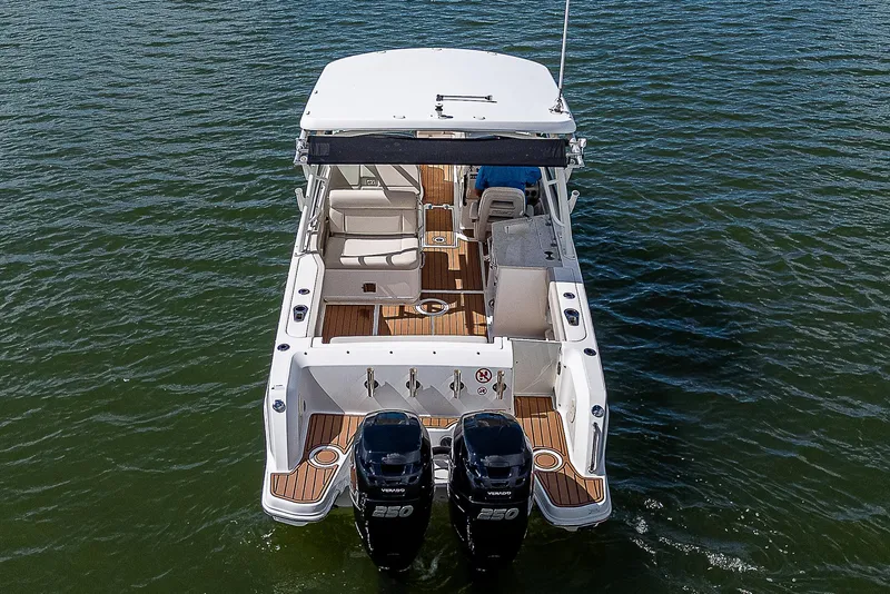 Slide: The Image of 2018 Boston Whaler 270 Vantage boat with dual engines on water. - 43