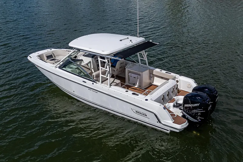 Slide: The Image of 2018 Boston Whaler 270 Vantage boat on water, featuring dual Mercury engines. - 45