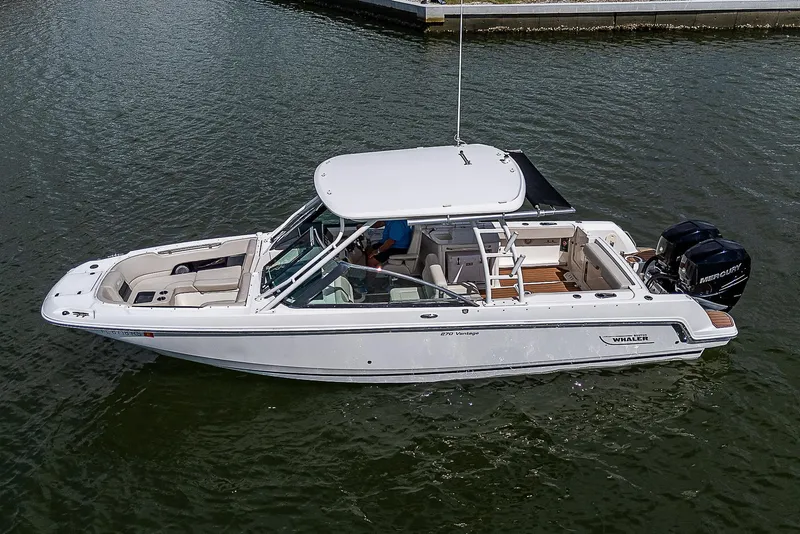 Slide: The Image of 2018 Boston Whaler 270 Vantage boat on water, side view. - 47
