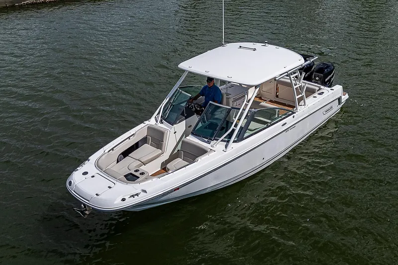 Slide: The Image of 2018 Boston Whaler 270 Vantage boat on water, featuring sleek design and spacious seating. - 48
