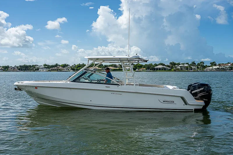 Slide: The Image of 2018 Boston Whaler 270 Vantage boat on calm water, clear sky background. - 8