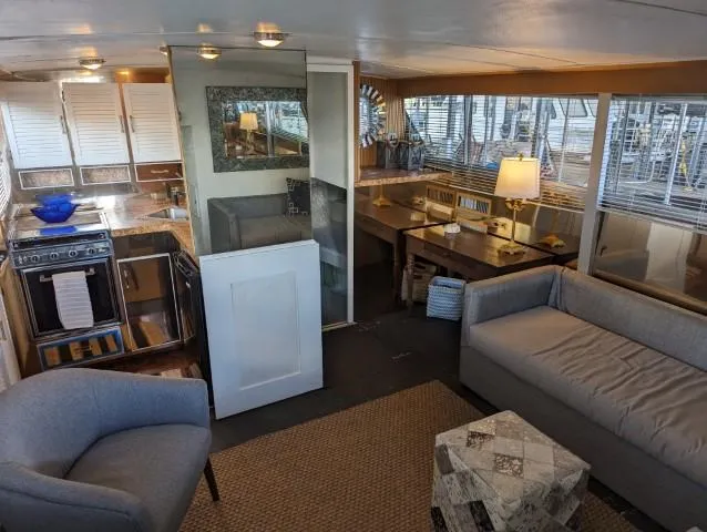 Slide: The Image of Interior of a 1972 Chris-Craft 41 Commander yacht with modern furnishings and decor. - 13